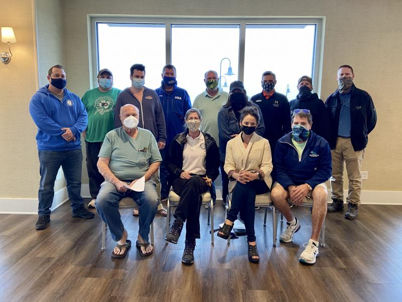 Dewey Business Partnership members are hopeful for a strong summer season. In back are (l-r) Regan Derrickson, Nalu; Nate Johnson, Wings to Go; George Bendler, Hammerheads; Steve “Monty” Montgomery, The Starboard; Commissioner Paul Bauer; Maria D’Ambrogi, Sirvida; Drew DiFonzo, Hyatt Place Dewey Beach; Jeff Treacy, Mezcali; and Town Manager Bill Zolper. In front are Bob Forwood, Wings to Go; Christine Hastings, Jolly Trolley; DBP Executive Director Kelly Ranieri and Jimmy O’Conor, Woody’s Dewey Beach. ELLEN DRISCOLL PHOTO